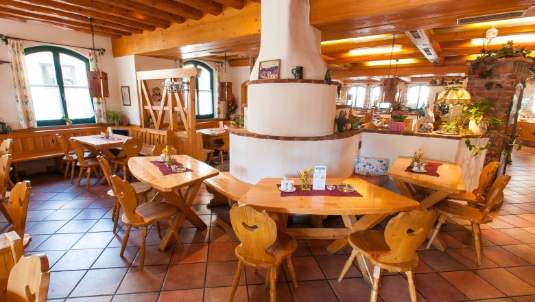 Mold maker, © Baumgartner J. Cozy restaurant with wooden furniture and rustic decor.