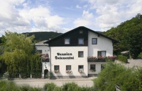A two-storey building with the inscription 'Pension Seelenental', surrounded by trees and bushes.