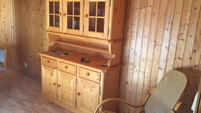 Real wood furnishings and armchair in the living room of the 100-year-old baggage car, &copy; M. Schorn